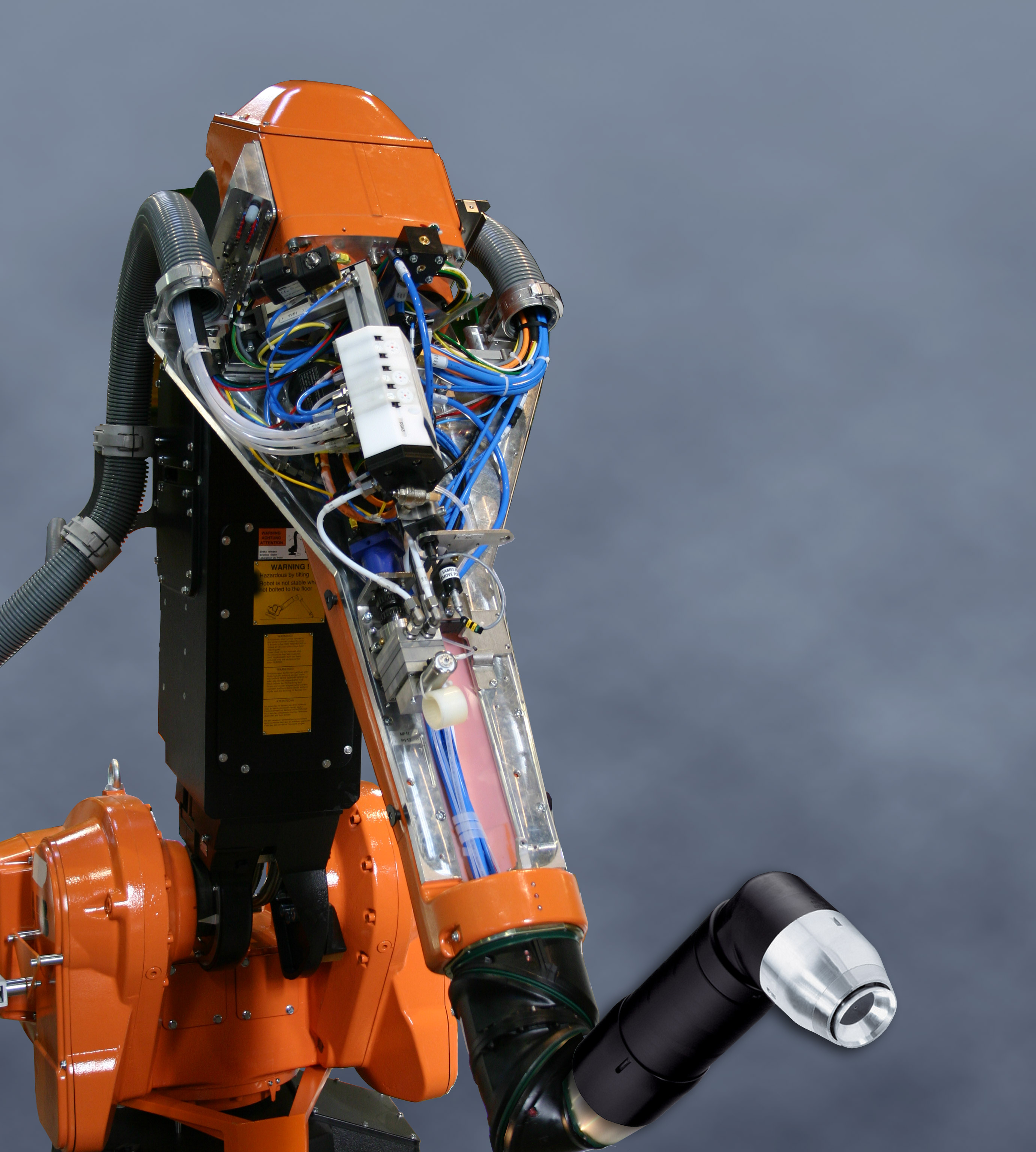 ABB painting robot with hollow-wrist internal routing for paint lines, air supply, and electrostatic cables